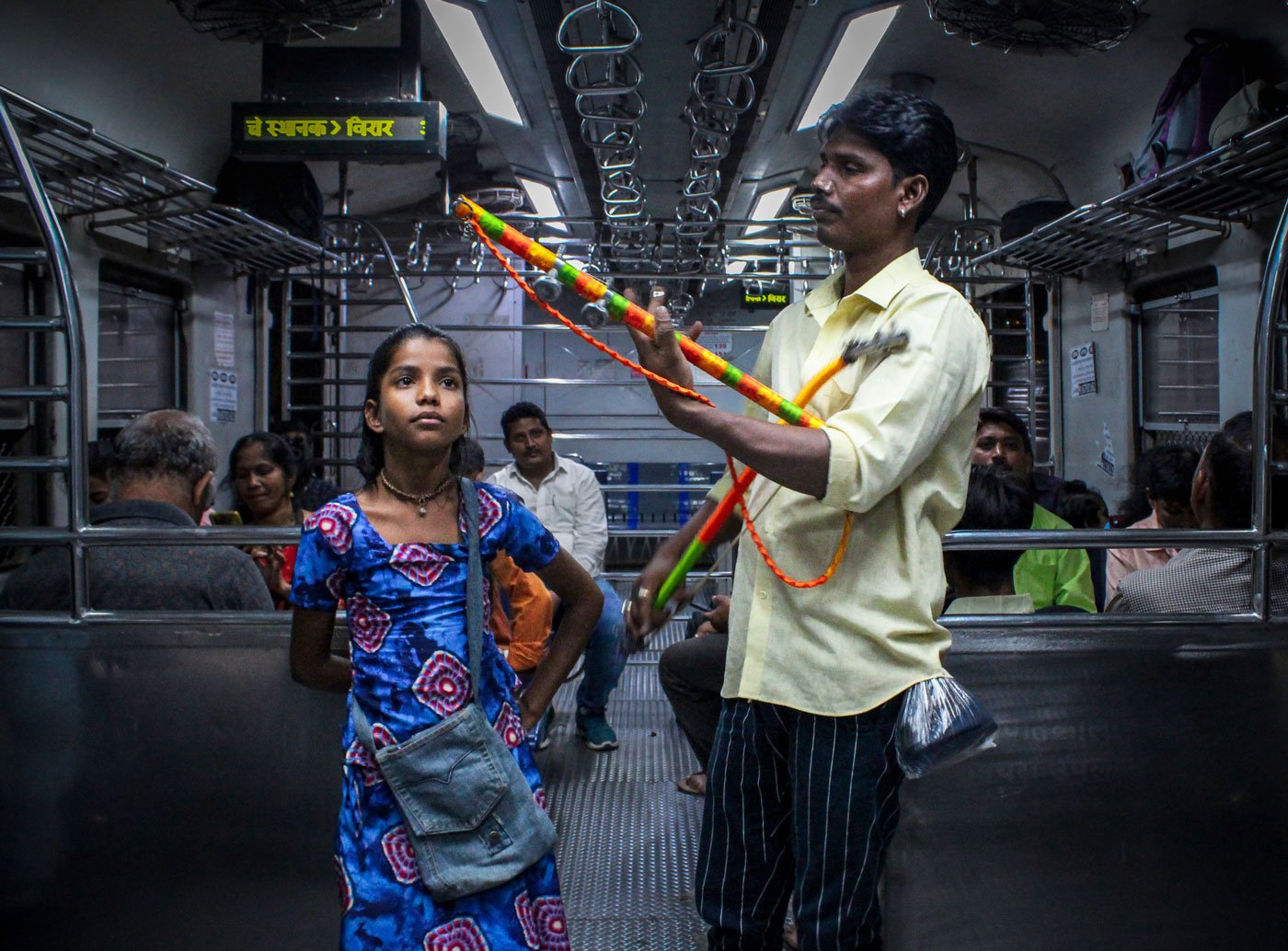 Kishan Jogi with his daughter Bharti as he plays the sarangi on the 7 o’clock Mumbai local train that runs through the western suburb line