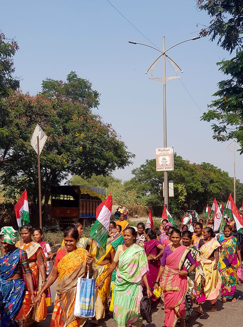 people marching toward collector's office