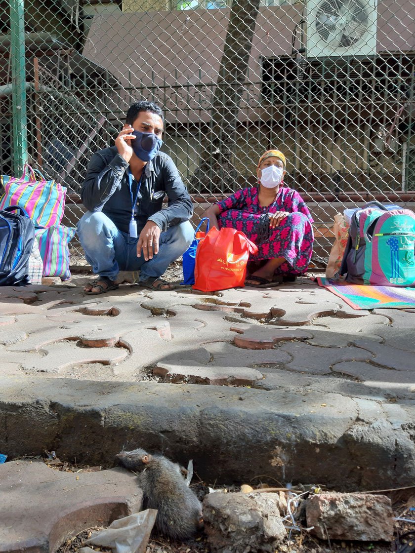 Satender and Geeta Singh lived on the footpath for two days, where rats scurry around, before shifting to their relative's place in Dombivali (left). They had moved back to the footpath outside Mumbai's Tata Memorial Hospital two weeks ago (right)

