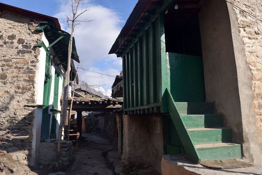 The new make-shift toilets stand out among the two-hundred year houses of Gunji village