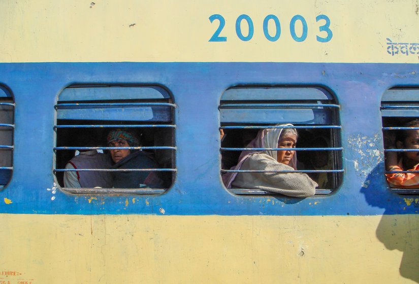 On the platform and in the train are more women like Buribai Nagpure (left) and Shakuntalabai Agashe (right), weary-eyed, hungry, half-asleep