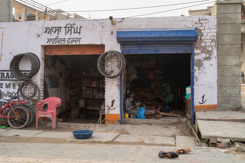 Left: Hans Raj’s rented workshop where he hand stitches and crafts leather juttis.