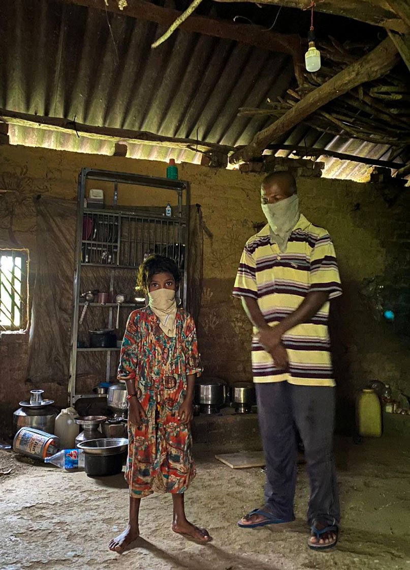 Nandini (left), Dilip Wagh's elder daughter, keeps crying looking at the photos of her deceased mother Mangal, and sister Roshni