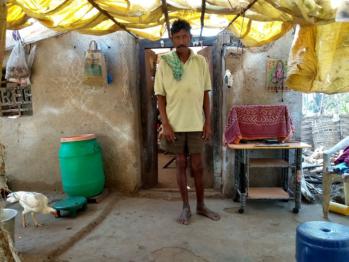 Bapiraju stands in front of his demolished house
