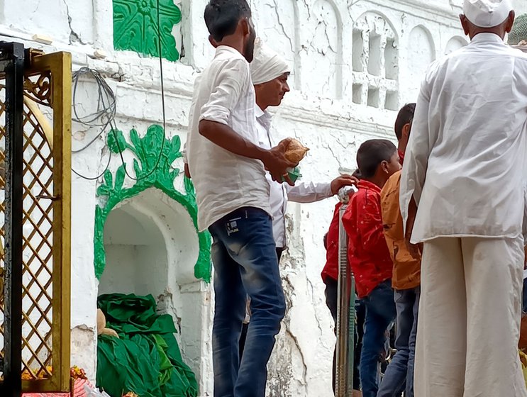 Left: Men offer nivad and perform the rituals at the mazar at Hazrat Sayyed Alwi (Rehmatullah Alaih) dargah (shrine) at Moha.