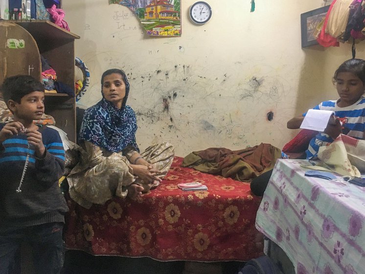 Rukhsana Khatoon and her eldest children Kapil and Chandni in their rented room in Shadipur Main Bazaar area of West Delhi.