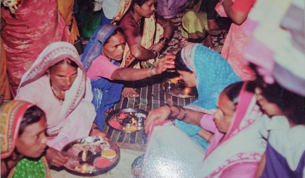 Left: A haldi-kumkum function with Savitrabai Ubhe and others from her village (file photo). Right: Savitrabai receiving flowers at the event