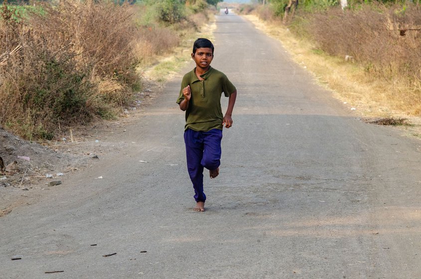 arsha Kadam practicing on the tar road outside her village. This road used was her regular practice track before she joined the academy.