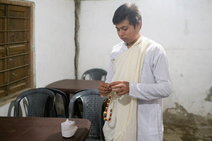 Left: Backstage at the Garamur Saru Satra, Partha Pratim Baruah, 16, checks his motamoni mala .