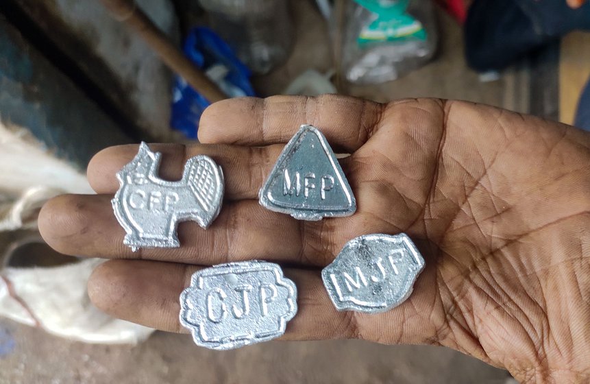 Every morning, Azeem parks his bicycle near the shop and begins his workday, moulding tokens with inscriptions or shapes of the dishes sold in eateries