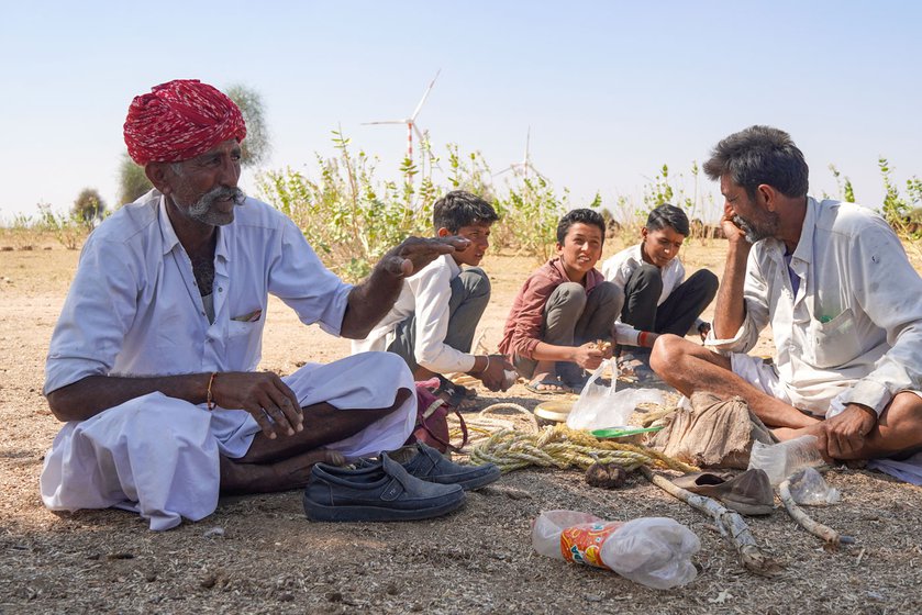 Right: Jora Ram (red turban) and his brother Masingha Ram bring their camels here to graze. Accompanying them are Dina Ram (white shirt) and Jagdish Ram, young boys also from the Raika community