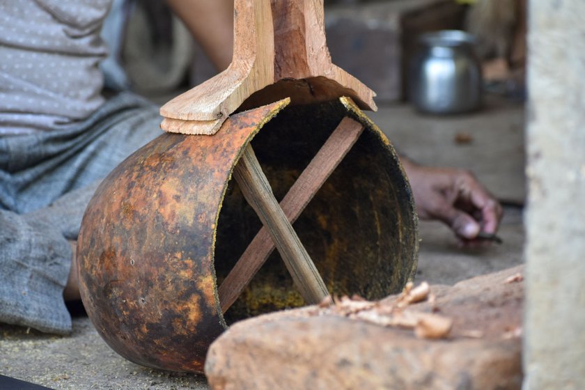 Right:  The gourd is cut into the desired shape and fitted with wooden sticks to maintain the structure