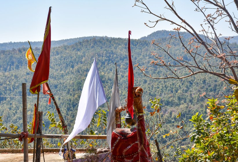 Right: White flags on the mountain belong to the nature worshipping Sarna tribals. The saffron flag represents the Hindus, who also have a temple on the top of the hill