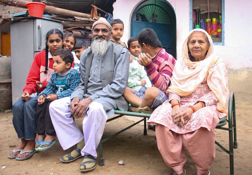 Right: Qureshi and his wife along with his grandchildren and Saini’s children