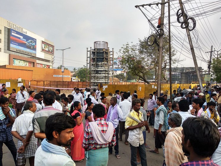 Migrant daily wage labourers seen early morning at the labour adda in Benz Circle looking for some work. Everyday, atleast 1000 people come here for work starting from 6 AM till 10 AM