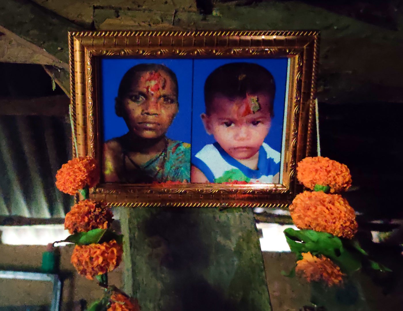 Nandini (left), Dilip Wagh's elder daughter, keeps crying looking at the photos of her deceased mother Mangal, and sister Roshni