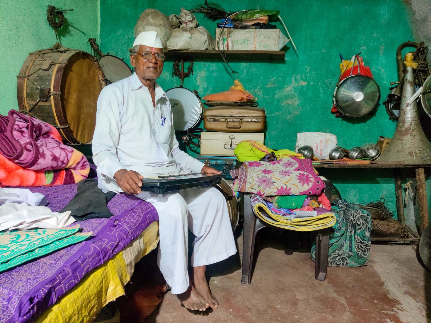 Left: A photo of the band in which Purushottam Misal (seen extreme left) played the trumpet. Right: Baburao Misal with his musical instruments at home
