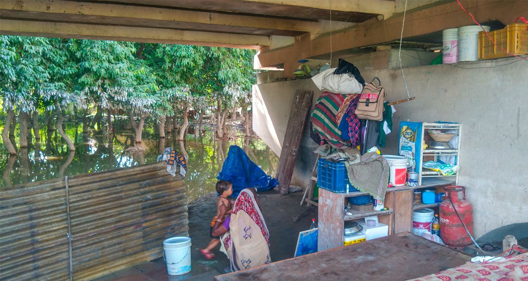 Hiralal is a resident of Bela Estate who has been displaced by the recent flooding of the Yamuna in Delhi. He had to rush with his family when flood waters entered their home in July 2023. They are currently living under the Geeta Colony flyover near Raj Ghat (right) with whatever belongings they could save from their flooded homes