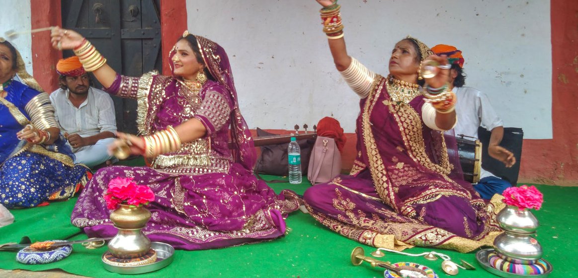A family from the Kamad community performing the Terah Tali folk dance. Artists, Pooja Kamad (left) and her mother are from Padarla village in Pali district of Jodhpur, Rajasthan