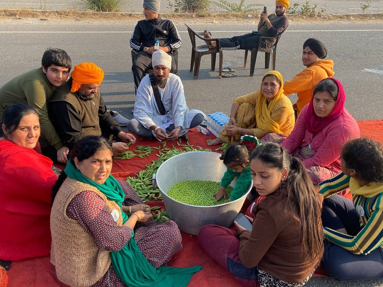 One of the youngest protestors at the Rajasthan-Haryana border pitches in to help his family prepare aloo mutter for a hundred people

