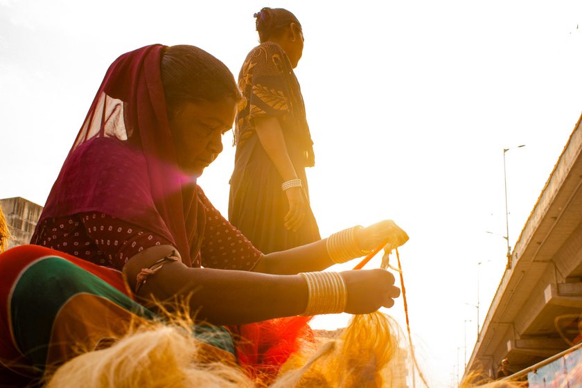 Santra Rajbhoi (left) belongs to the Rajbhoi nomadic community in Gujarat. Women in this community – including Saranga (seated) and Saalu – practice the traditional occupation of rope-making