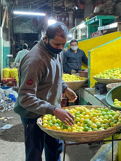 Inspecting lemons at the mandi in Dadar, Mumbai