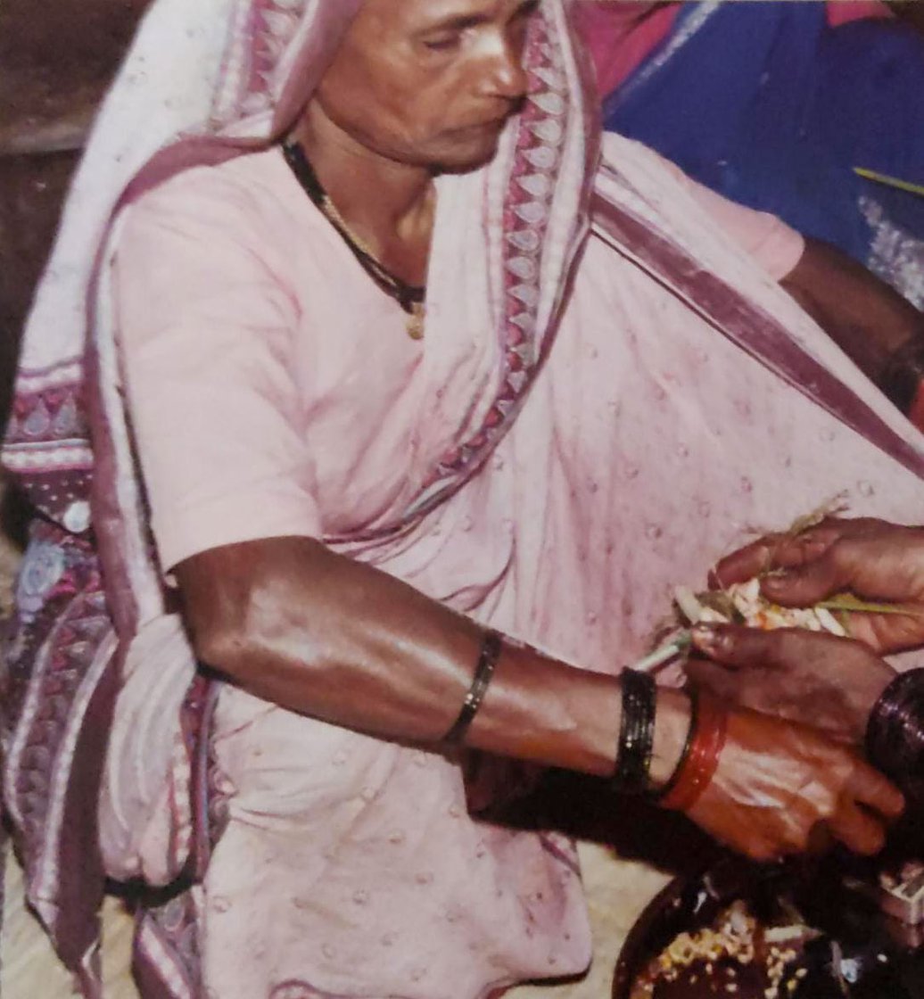 Left: A haldi-kumkum function with Savitrabai Ubhe and others from her village (file photo). Right: Savitrabai receiving flowers at the event