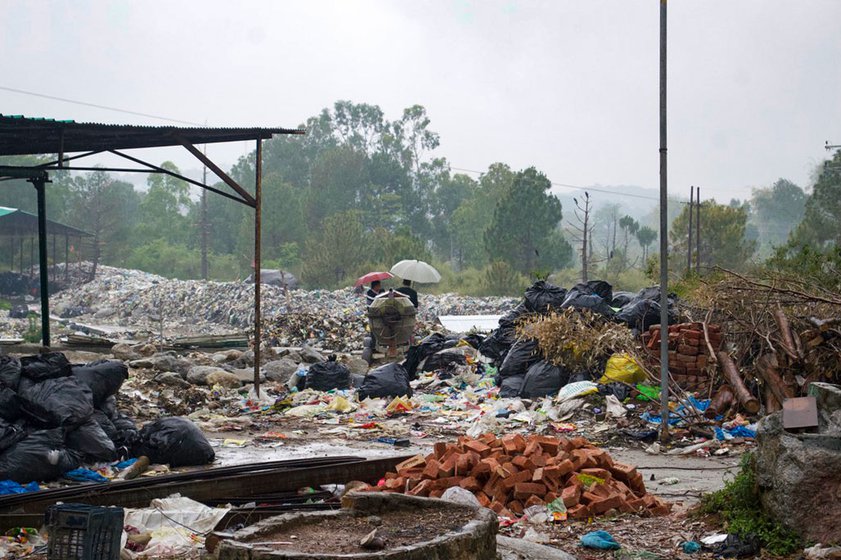 Right: (In the background) Ashish Sharma, the Municipal Commissioner of Palampur and Saurabh Jassal, Deputy Commissioner Kangra, surveying the dumpsite