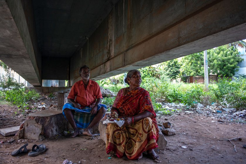 Sitting under the Singarathope bridge, Kala is eating lunch from a nearby eatery.  She says, ' A meal costs around Rs. 30 to 40, depending on whether I take a curry in addition to a piece of fish. Often it is late by the time I get to eat'