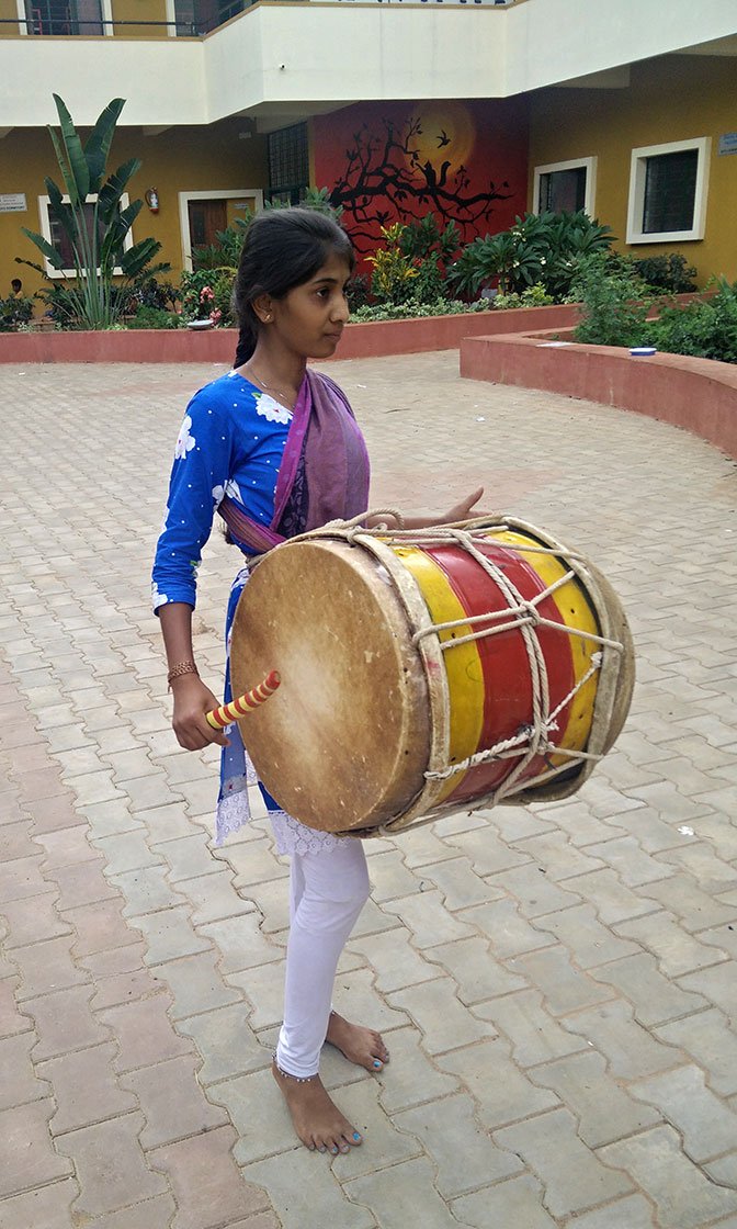 Gautami plays the dollu kunitha
