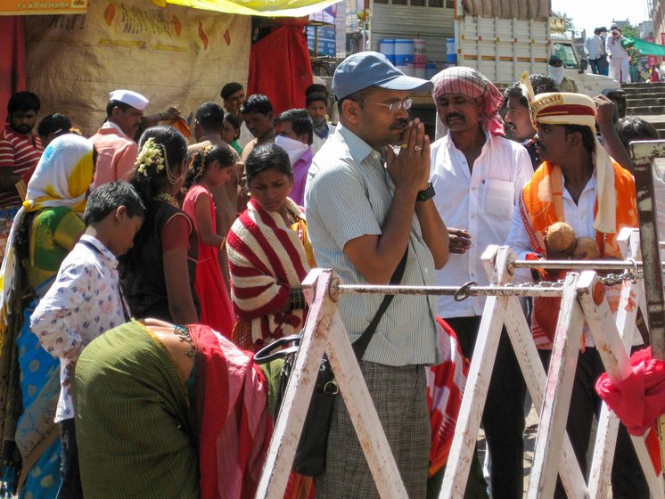 'It is first time in the history that we are witnessing this', says Sanjay Pende (left), a priest at the Tulja Bhavani temple, which usually sees a throng of devotees (right)


