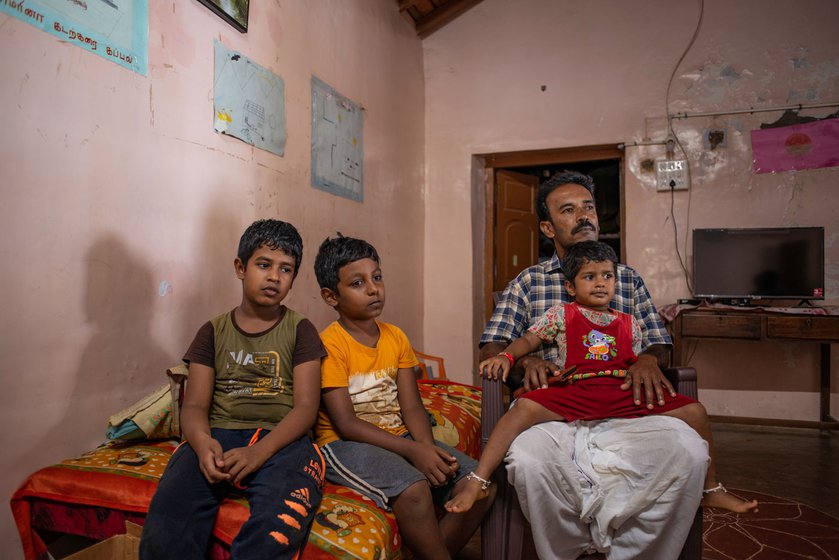 Thiru at home with his children and a relative’s son