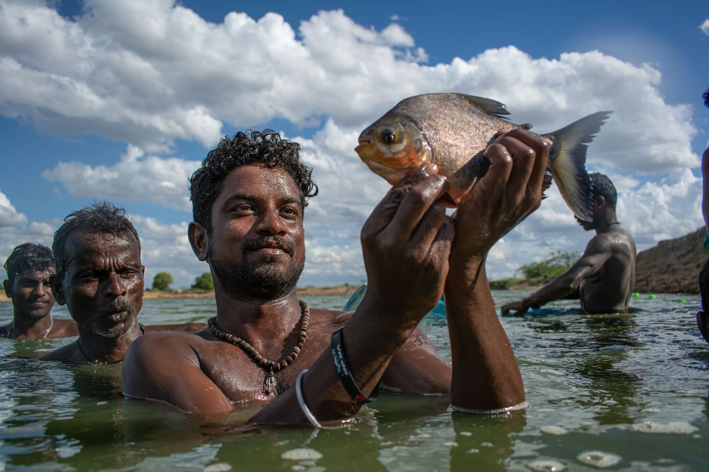 Senthil Kalai shows his catch of kamma paarai fish. He enjoys posing for pictures