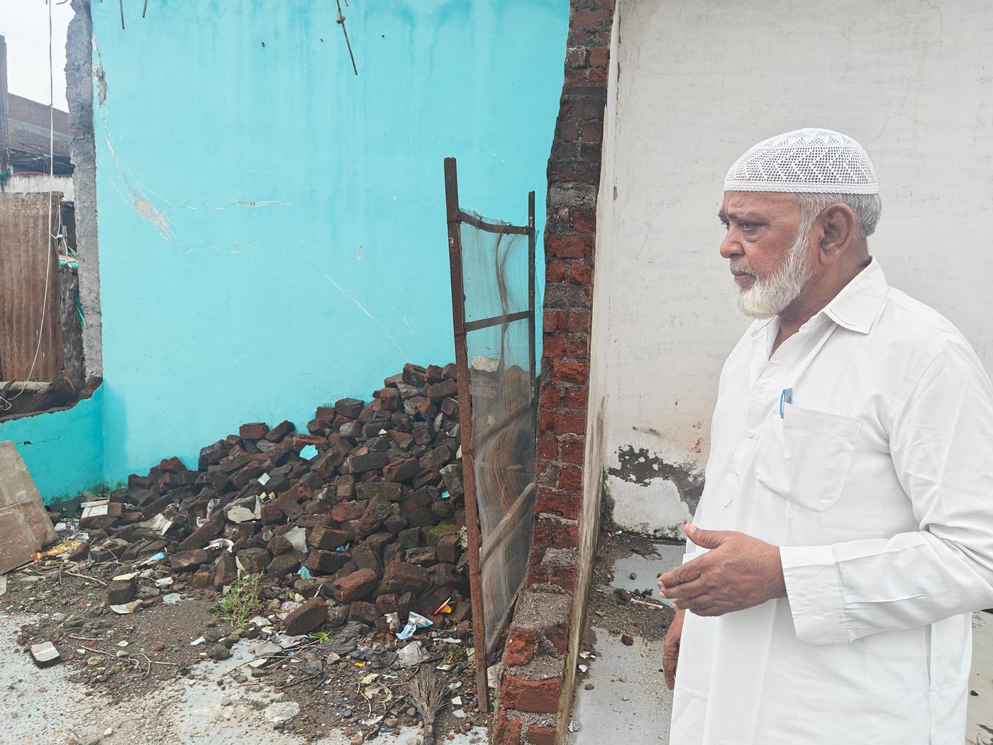 Mohammad Rafique surveying the damage done to his shop in Khargone’s Chandni Chowk by bulldozers