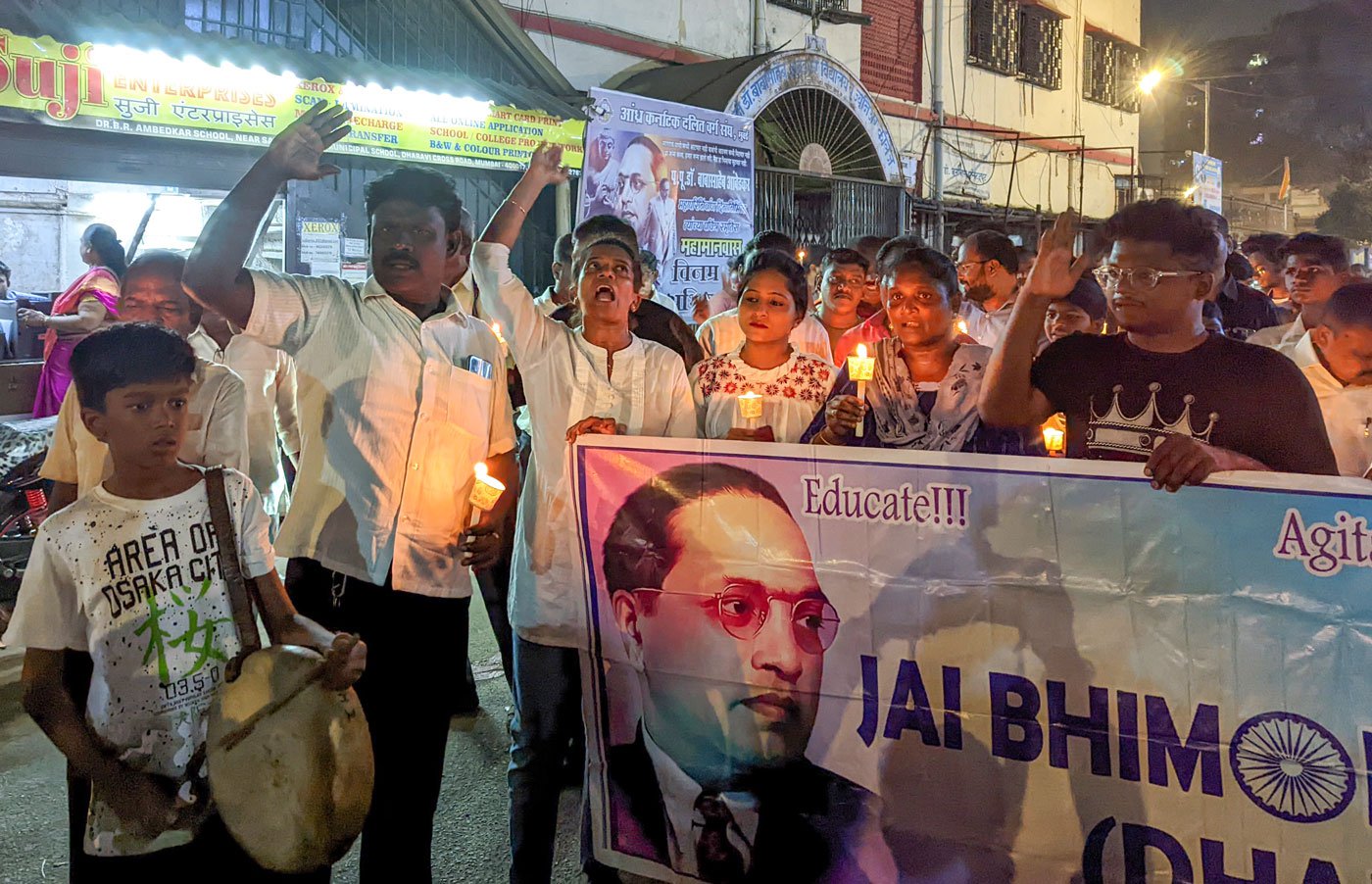 Tamil slogans are shouted during the rally as most participants are from Tamil-speaking homes. Aran (boy on the left) plays the parai instrument in the rally