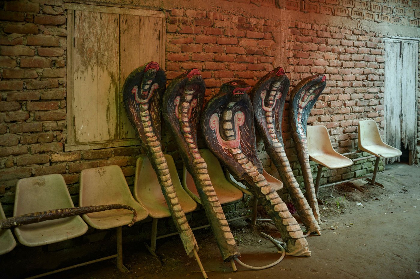 The five hoods of the mythical snake Kaliyo Naag rest against the wall at the Garamur Saru Satra. Handmade props such as these are a big part of the festival performances.
