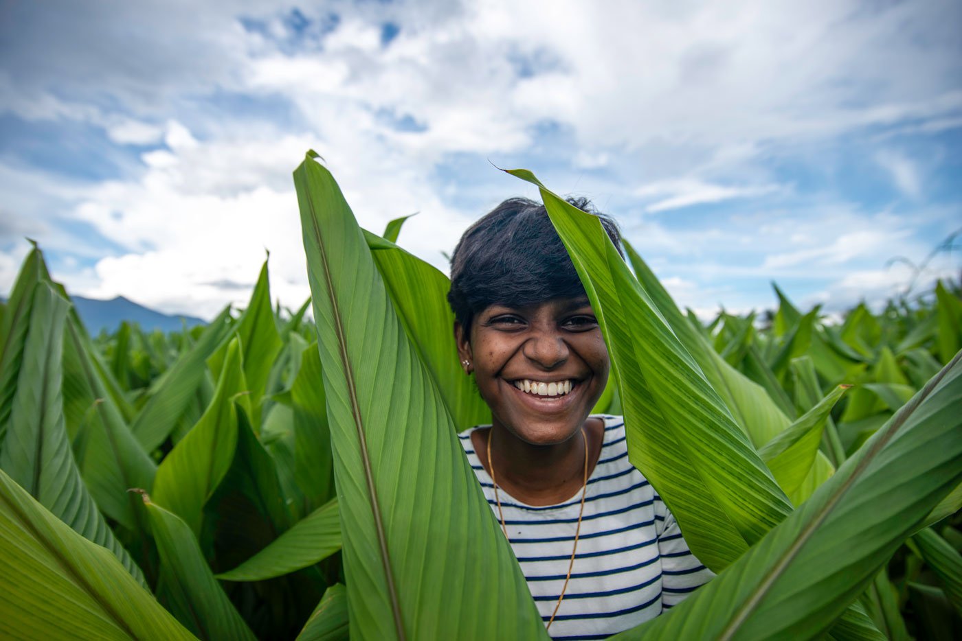 Akshaya in Thiru Murthy's farm in Sathyamangalam. She repackages and resells the turmeric he grows