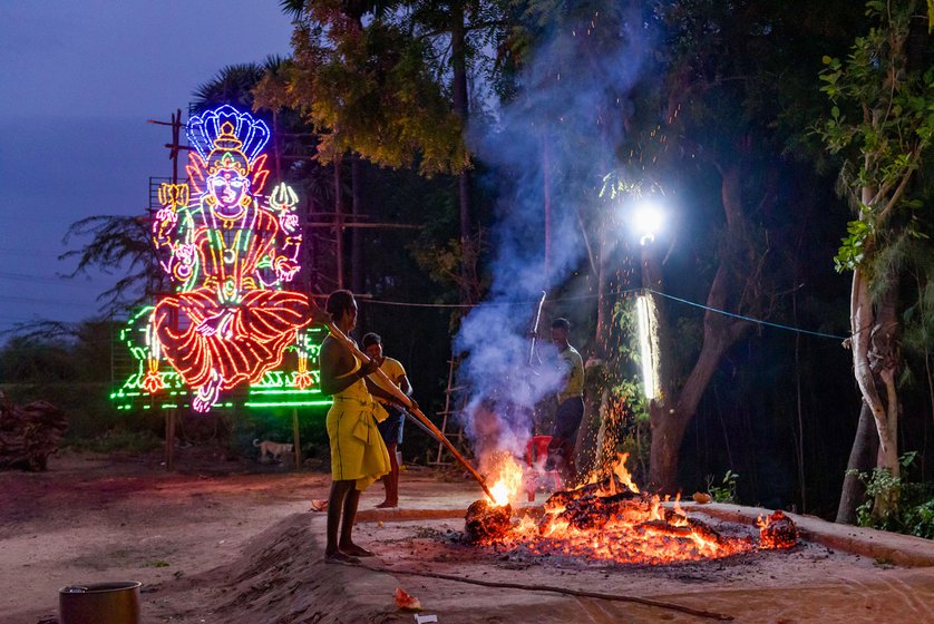 Left: Preparing for the theemithi thiruvizha for goddess Om Sakthi, volunteers in wet clothes stoke the fire to ensure logs burn evenly. Before the fire-walk, they need to spread the embers evenly over the fire pit.