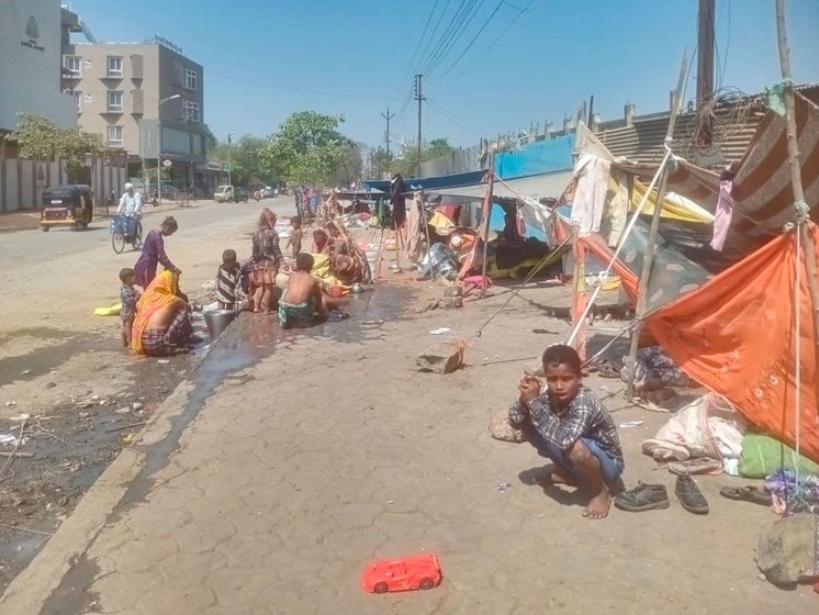 Left: Children taking a bath near the road settlements. Right: An enclosure created for men to bath