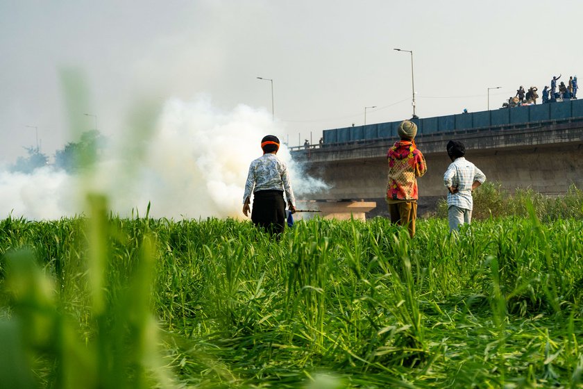 As protestors started to break through the barricades at Shambhu, the police officials fired multiple tear gas shells. Elder farmers and labourers diffused the shells with a stick