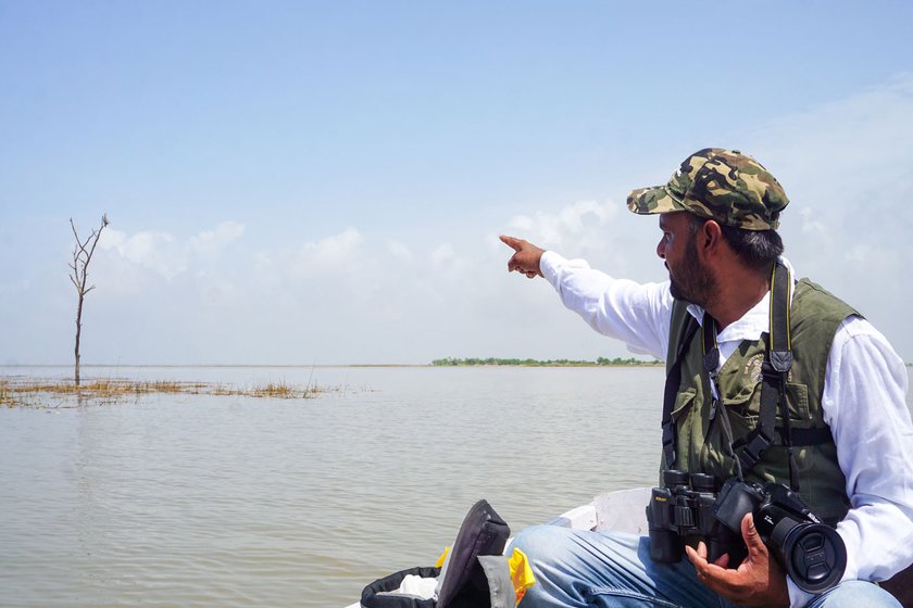 Left: Gani pointing at a bird on the water.