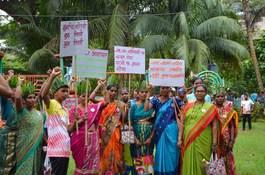 Left: Women hold up posters before the rally.