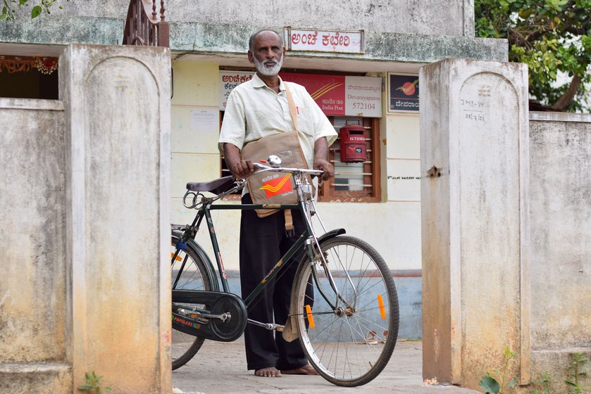 Renuka travels on his bicycle (left) delivering post. He refers to a hand drawn map of the villages above his desk (right)