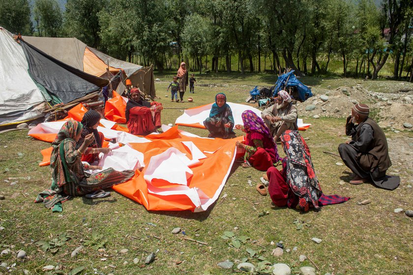 Left: Women from the Bakarwal community sewing tents out of polythene sheets to use in Minimarg.