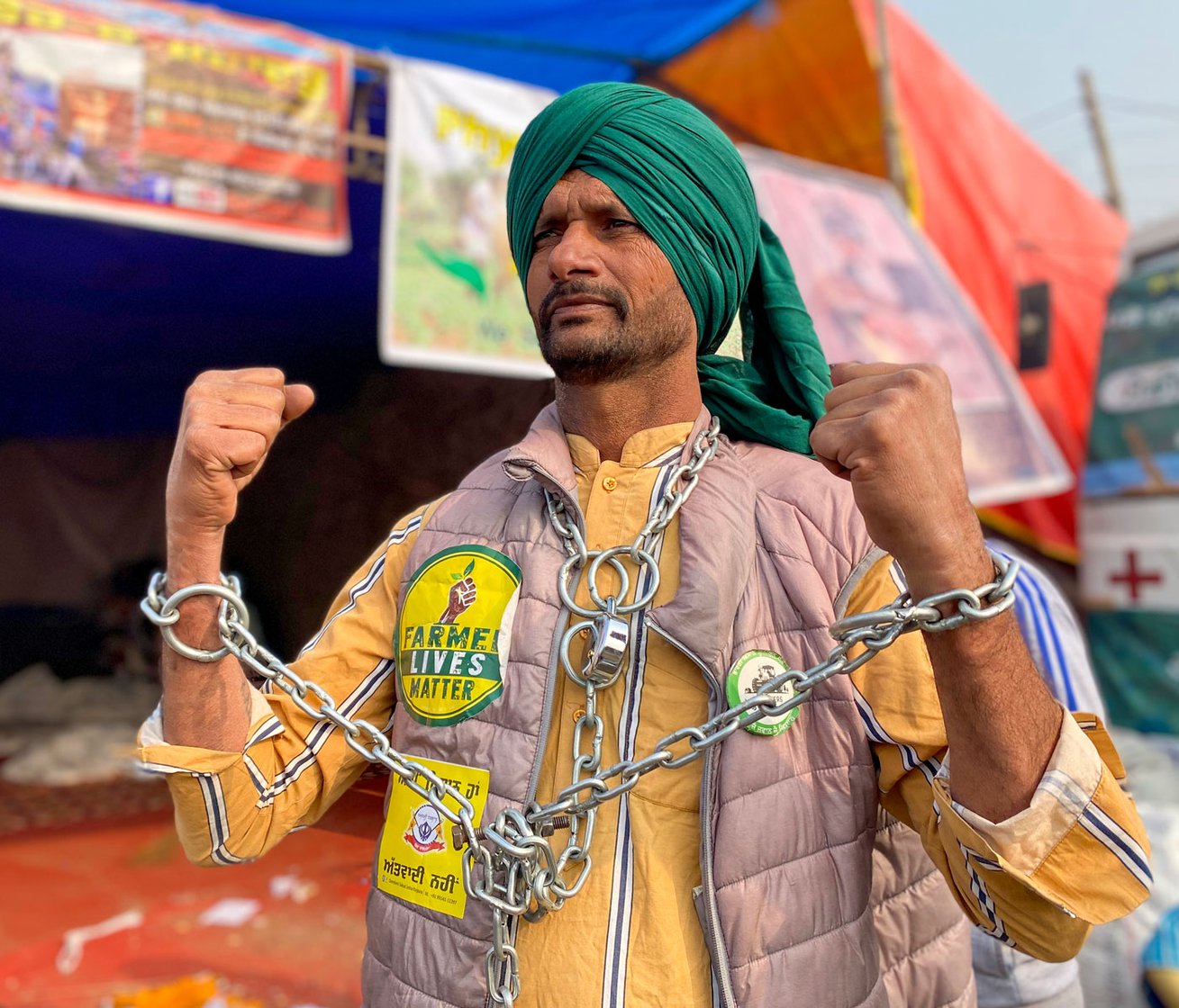 Left: A farmer protesting with chains at Singhu. In the pandemic year, not a paisa's concession was made to farmers by way of guaranteed MSP. Right: Last year, migrants on the outskirts of Nagpur. If India levied wealth tax at just 10 per cent on 140 billionaires, we could run the MGNREGS for six years