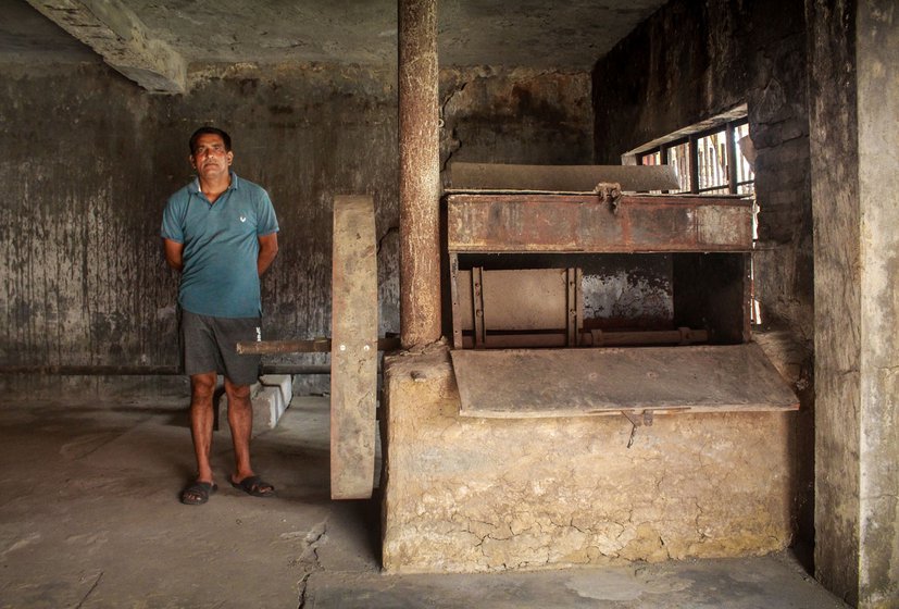 Many farmers have their own machines to process the leaves. Rajinder (left) standing next to his machine housed in a makeshift room outside his house that he refers to as his factory.