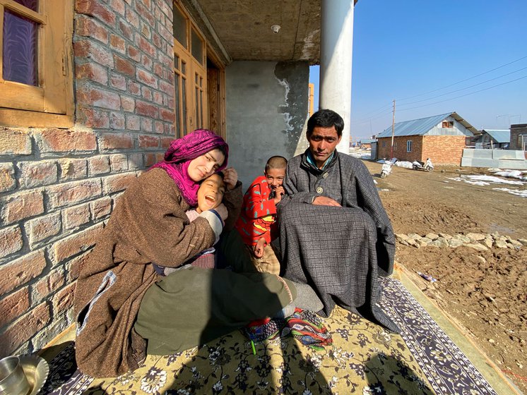 The family sitting in the sun outside Arshid’s parents’ home in Rakh-e-Arth, Srinagar