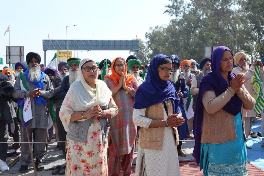 Left: Surinder Kaur, along with other women, praying for strength to carry on with the protest.