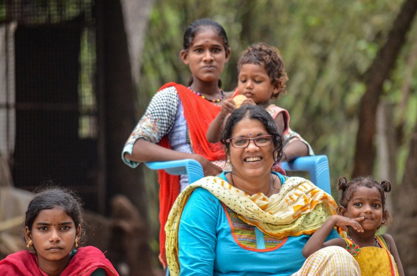 Prema Revathi (left) with some of Vanavil's residents. Most of the school's students have been sent home, but a few remain on the campus (file photos)

