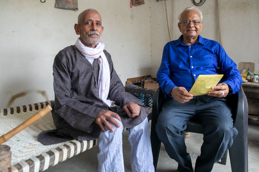 Left: Jagdish Prasad Tyagi and Surendra Nath Awasthi (in a blue shirt) reminiscing about the struggle for a bridge over the Sai river .